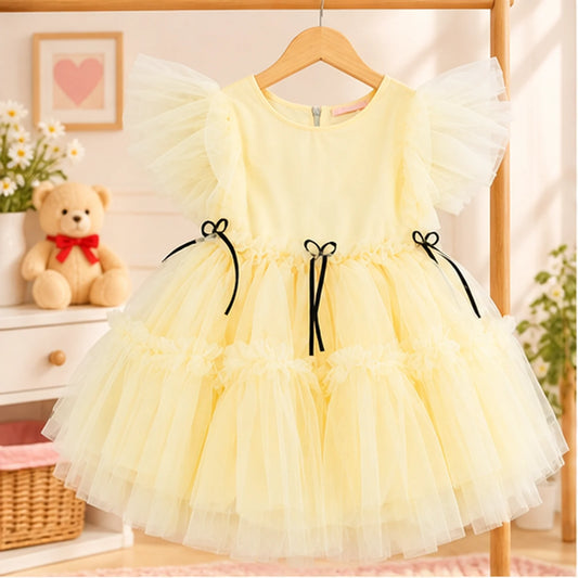 Vestido de festa infatil em tule amarelo com laços pretos